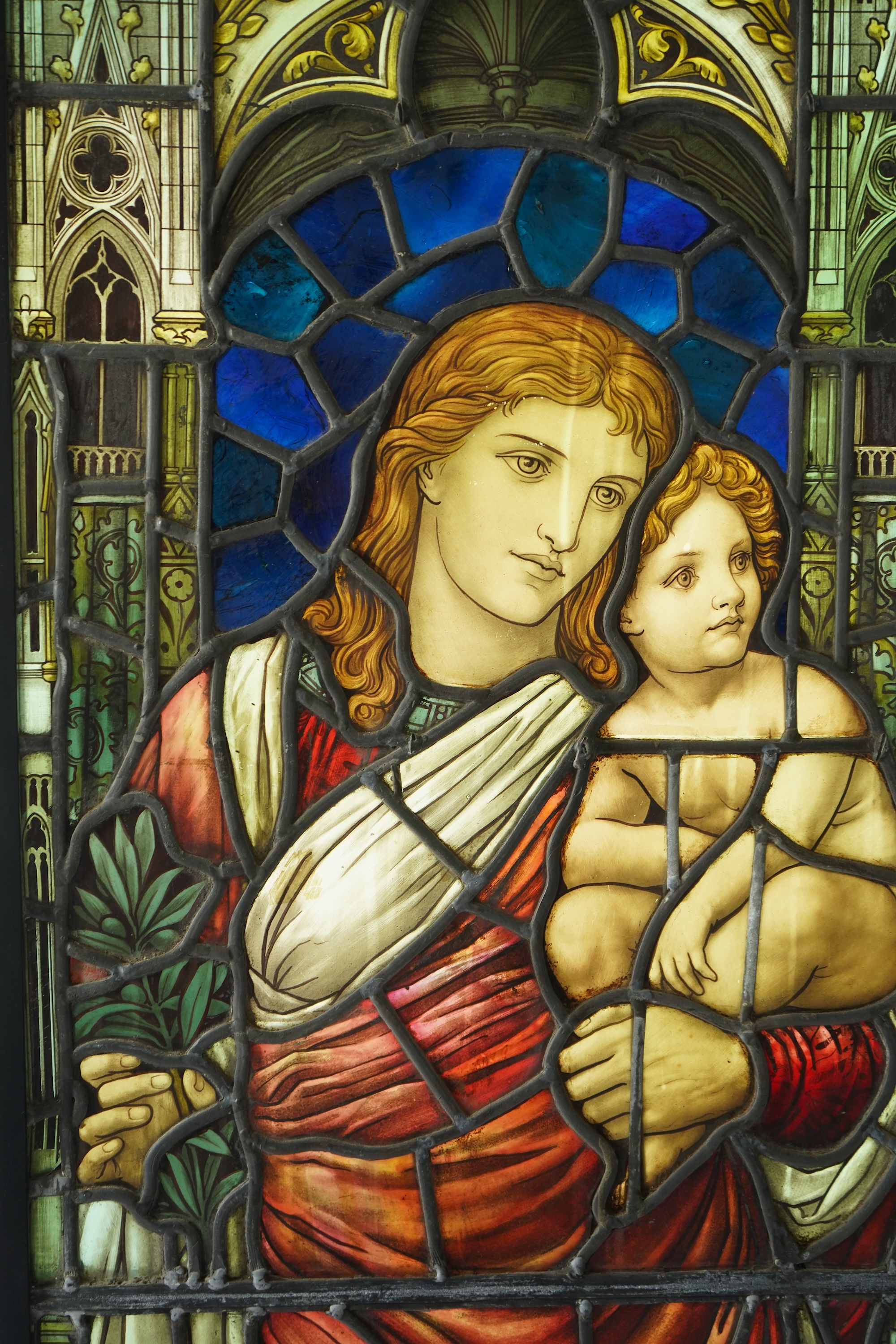 Attributed to Henry Holiday (1839-1927) for James Powell & Son: A stained and painted glass panel depicting the Virgin and Child